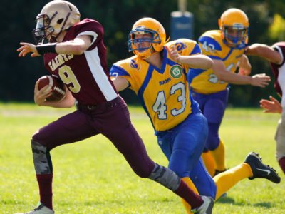 Graeme Heighway (#9) runs away from a defender during a game
