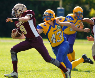 Graeme Heighway (#9) runs away from a defender during a game