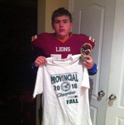 Devon Martin poses at home with provincial champs gear