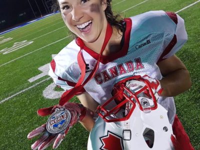 A jubilant Ruller proudly displays her silver medal from the 2017 IFAF Women's Worlds (Image obtained from Facebook)