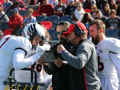 Carleton's coaches review a play at the 2017 Panda Game held at TD Place, Ottawa, ON, on Sep 30, 2017. By Robert Young.