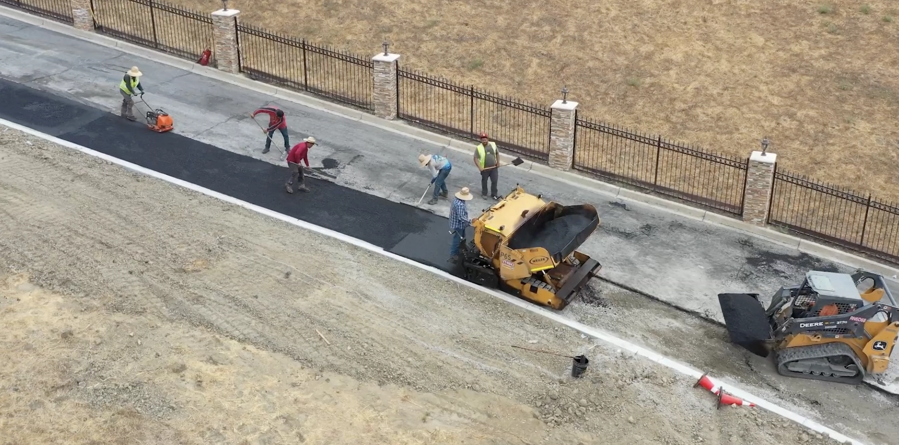 This image showcases a freshly paved asphalt surface completed by Earthtek Grading and Paving Inc. The photograph highlights the smooth, even texture of the blacktop, demonstrating the company's expertise in grading and paving for commercial or residential projects. Visible markings on the pavement suggest the area is prepared for parking or roadway use, reflecting attention to detail and quality craftsmanship. The surrounding curbs and slight elevation changes indicate professional grading, ensuring proper drainage and durability. This image showcases a freshly paved asphalt surface completed by Earthtek Grading and Paving Inc. The photograph highlights the smooth, even texture of the blacktop, demonstrating the company's expertise in grading and paving for commercial or residential projects. Visible markings on the pavement suggest the area is prepared for parking or roadway use, reflecting attention to detail and quality craftsmanship. The surrounding curbs and slight elevation changes indicate professional grading, ensuring proper drainage and durability.