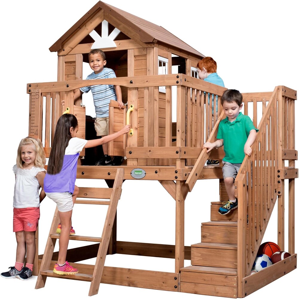 Backyard Discovery Scenic Heights Elevated Cedar Wooden Kids Playhouse with Play Kitchen, Wrap-Around Deck, Toy Storage Bench, Saloon-Style Doors, Ladder, Stairs, and Growth Chart for Outdoor Play