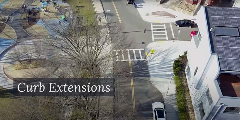 Figure 10: Pedestrian Zone Bump Out (Curb Extension) in an Urban Setting. This screenshot from the City of Boston’s Street Planning and Design Glossary video shows a concrete curb extension.