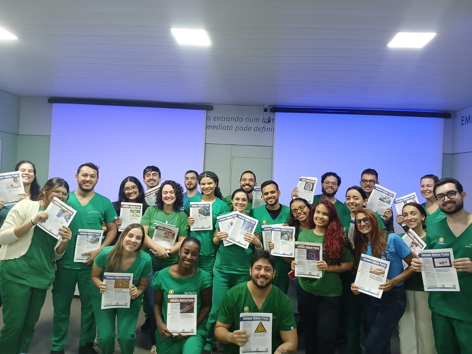 Emergency medicine residents in Fortaleza holding issues of Emergency Medicine Practice