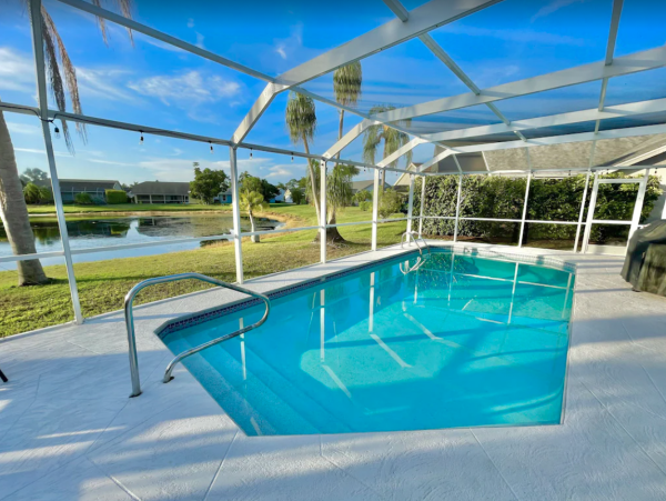 Lake  Front Four Bedroom Vacation Home with Caged Pool