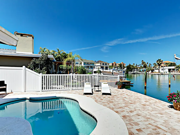 Indian Rocks FL Colorful Beach Home with Canal Front Pool