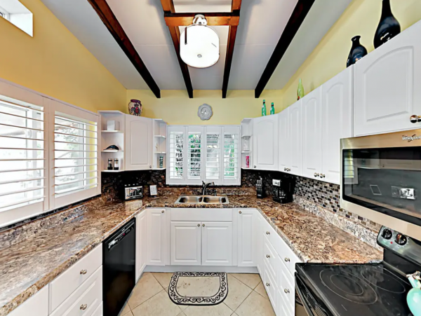 Indian Rocks FL Colorful Beach Home with Canal Front Pool