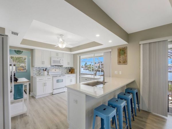 Marco Island Vacation Rental with Caged Pool and Boat Dock