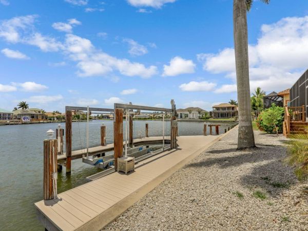 Marco Island Vacation Rental with Caged Pool and Boat Dock