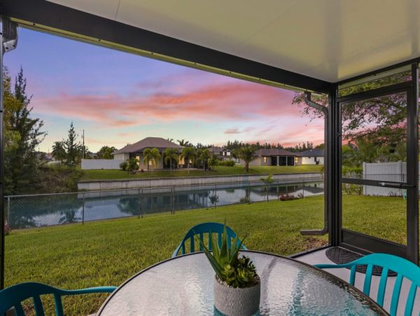 Canal Front Charming 4 Bedroom Home with Screened Patio