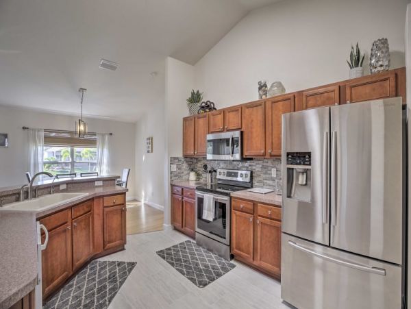 Canal Front Charming 4 Bedroom Home with Screened Patio