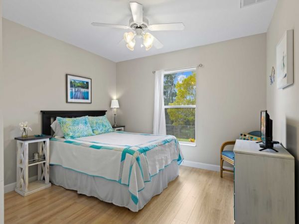 Canal Front Charming 4 Bedroom Home with Screened Patio