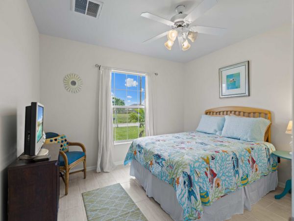 Canal Front Charming 4 Bedroom Home with Screened Patio