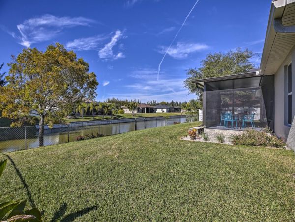 Canal Front Charming 4 Bedroom Home with Screened Patio