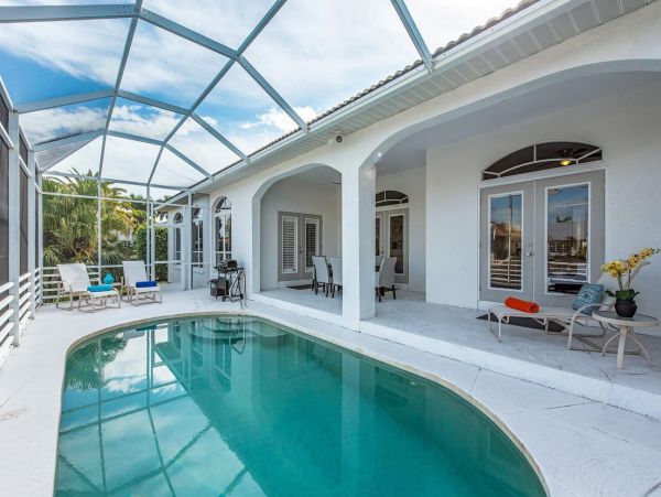 Naples Vacation Rental - Vanderbilt Beach Luxury Home with Pool & Canal Access