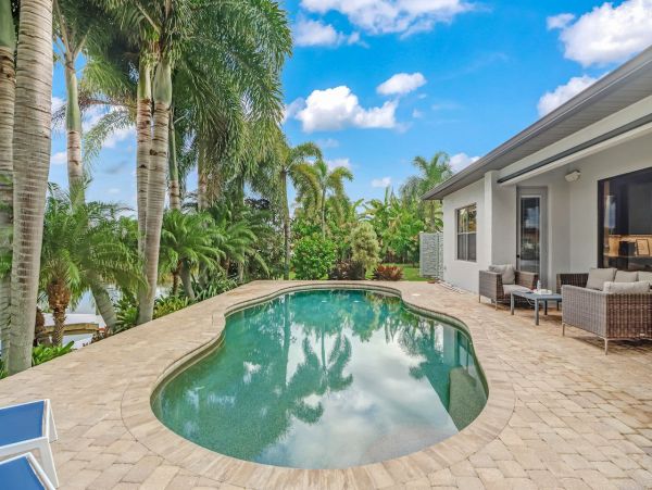 Canal-Front Vacation Home with Pool and Boat Dock