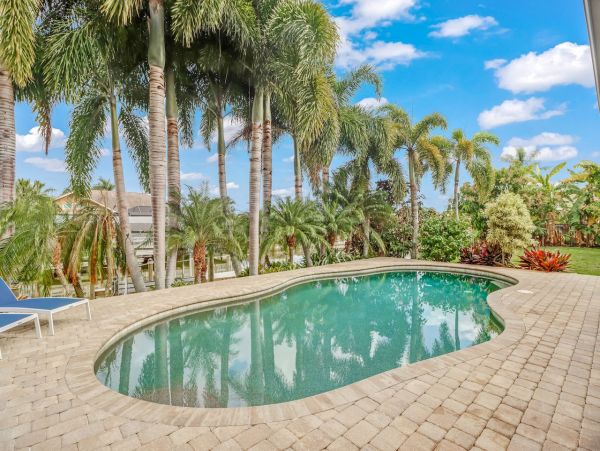 Canal-Front Vacation Home with Pool and Boat Dock