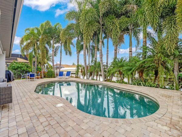 Canal-Front Vacation Home with Pool and Boat Dock