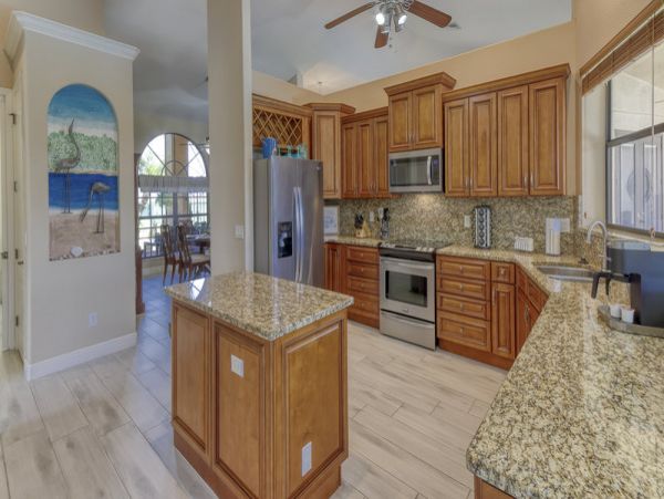 Charming Vacation Home Cape Coral with Caged Pool Sleeps 9