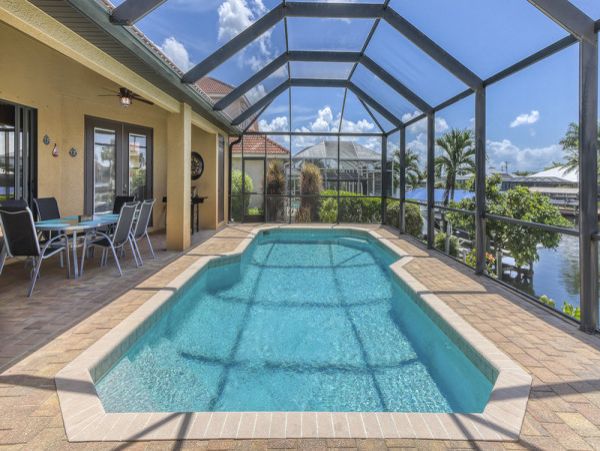 Charming Vacation Home Cape Coral with Caged Pool Sleeps 9