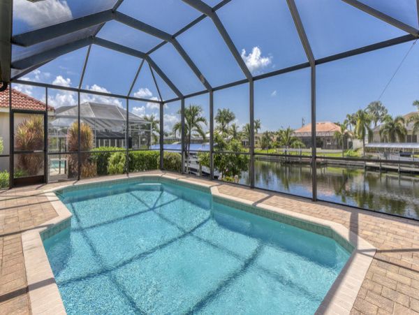 Charming Vacation Home Cape Coral with Caged Pool Sleeps 9
