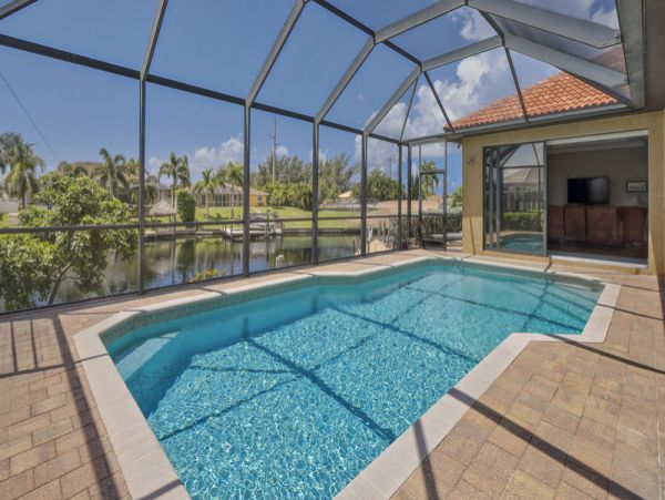 Charming Vacation Home Cape Coral with Caged Pool Sleeps 9