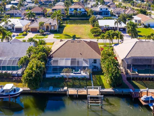 Fabulous 3 Bedroom/2 Bath Waterfront Home with Caged Pool