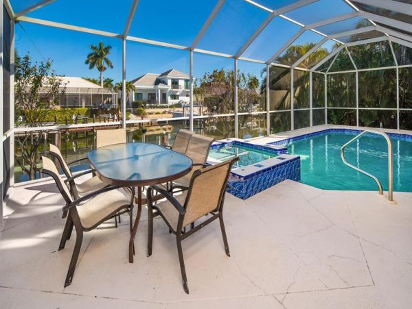 Fabulous 3 Bedroom/2 Bath Waterfront Home with Caged Pool