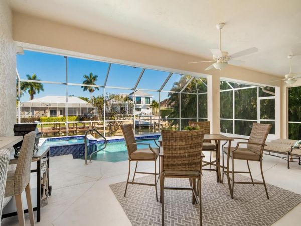 Fabulous 3 Bedroom/2 Bath Waterfront Home with Caged Pool