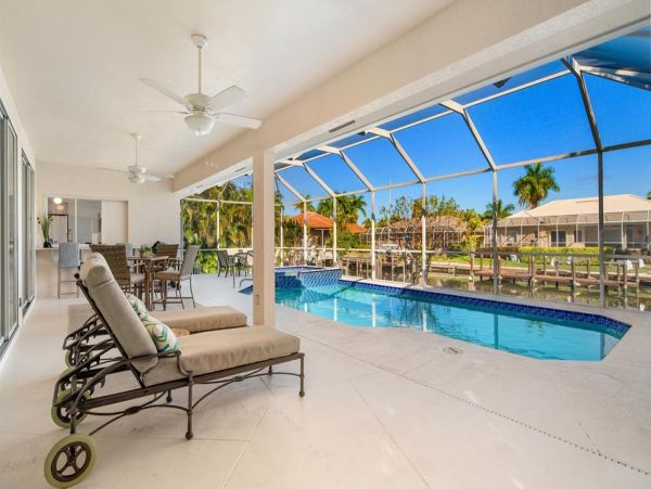Fabulous 3 Bedroom/2 Bath Waterfront Home with Caged Pool