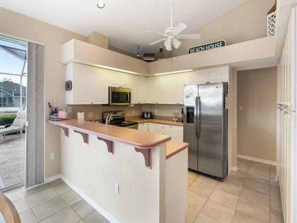 This Three Bedroom Lovely Marco Home Awaits your Arrival