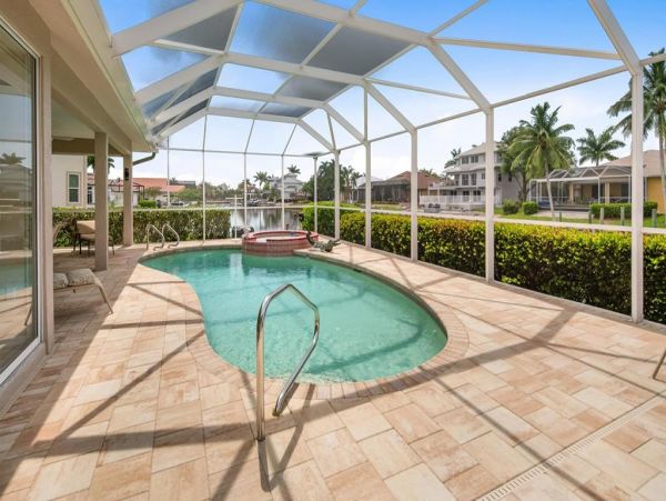This Three Bedroom Lovely Marco Home Awaits your Arrival