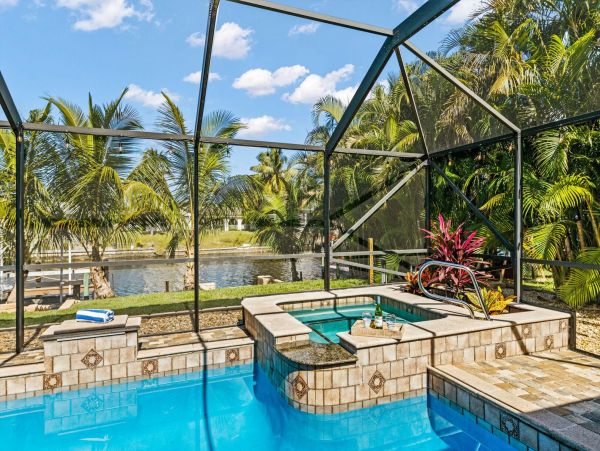Be Charmed by This Cape Coral Pool Vacation Home