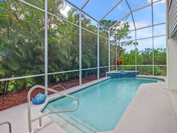 Great Outdoor Living Space with TV, Heated Pool & Outdoor Grill