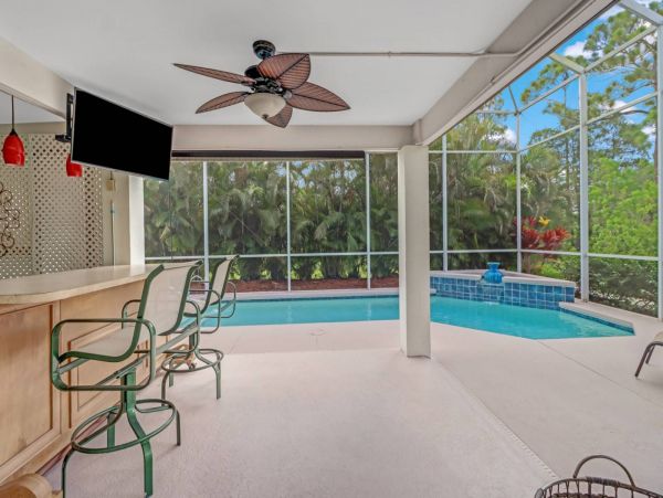 Great Outdoor Living Space with TV, Heated Pool & Outdoor Grill