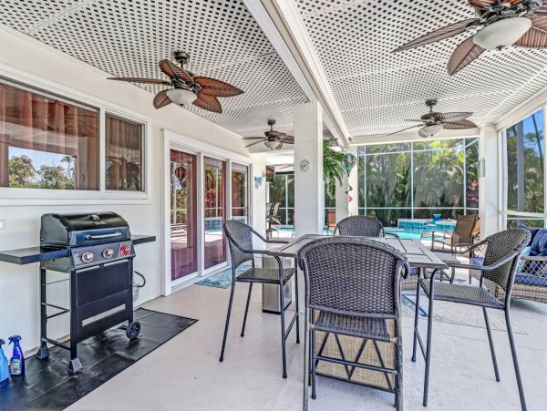 Great Outdoor Living Space with TV, Heated Pool & Outdoor Grill