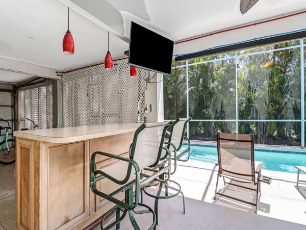 Great Outdoor Living Space with TV, Heated Pool & Outdoor Grill