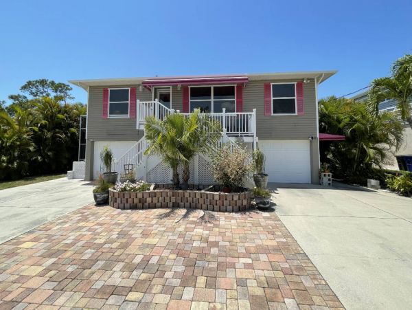 Great Outdoor Living Space with TV, Heated Pool & Outdoor Grill