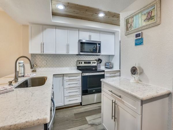 Treasure Island Beachfront Condo Luxury Oceanfront Vacation Rental with Pool & Bay Views
