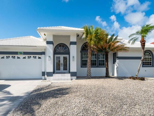 Canal-Front Vacation Home with Pool and Boat Dock