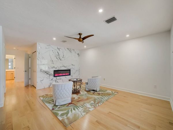 Second master suite provides an area to unwind and enjoy the fireplace