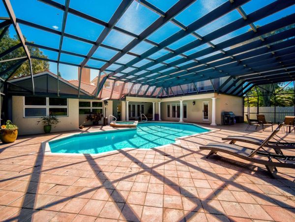 Paradise awaits with this spacious screened in lanai and pool