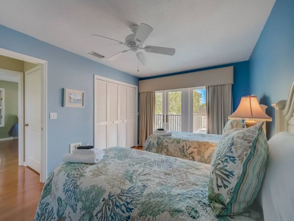 Upstairs bedroom - twin beds - connecting to spacious deck with plenty of closet space