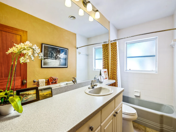 Adorable Two Bedroom Home with Caged Pool & Great Location