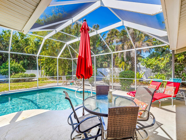 Adorable Two Bedroom Home with Caged Pool & Great Location