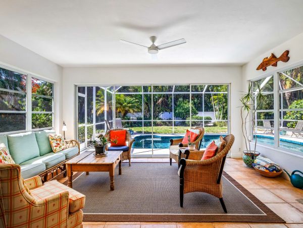 Adorable Two Bedroom Home with Caged Pool & Great Location
