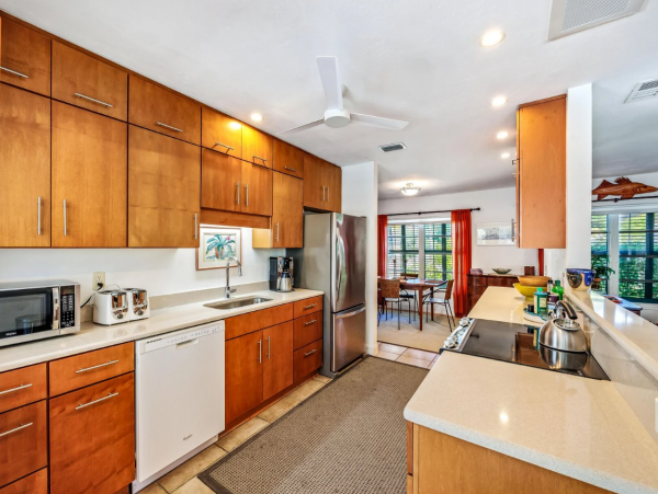 Adorable Two Bedroom Home with Caged Pool & Great Location