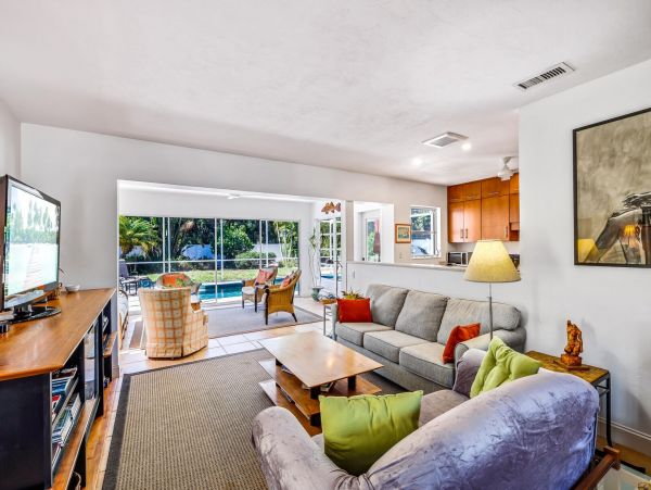 Adorable Two Bedroom Home with Caged Pool & Great Location
