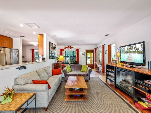 Adorable Two Bedroom Home with Caged Pool & Great Location